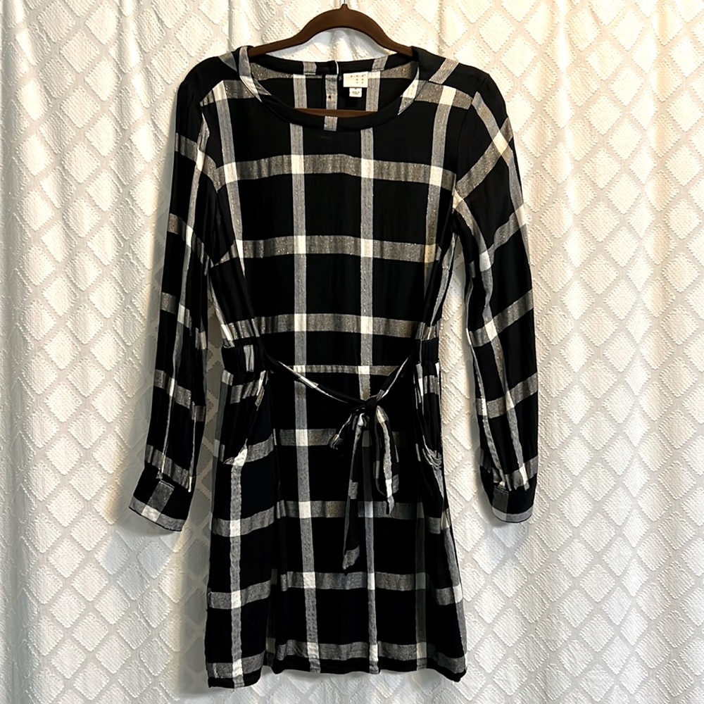 a new day black, white, and gold tie-front dress with pockets and button back